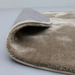 Vloerkleed Cowan rond taupe 15^Trendhopper Online